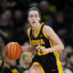 Iowa's Caitlin Clark OK after court-storming Buckeyes fan knocked her down following Ohio State upset - Yahoo Sports