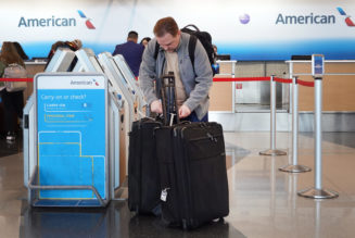 American Airlines raises bag fees, won't allow some travel agency bookings to earn miles