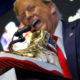 Donald Trump Booed At Sneaker Con While Selling Sneakers, X Clowns His Gold MAGA Fraud 1’s