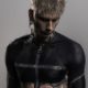 Machine Gun Kelly gets "spiritual" blackout tattoo on upper torso