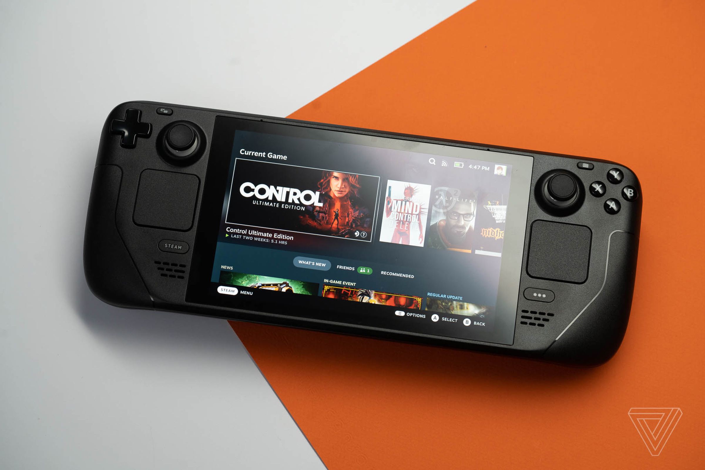 A Steam Deck on a white and orange background.