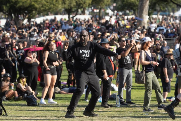 A fan of the band Ministry dances during their performance...