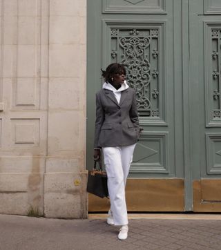 Amy Lefévre wearing a white sweatsuit with a gray hourglass Aritzia blazer