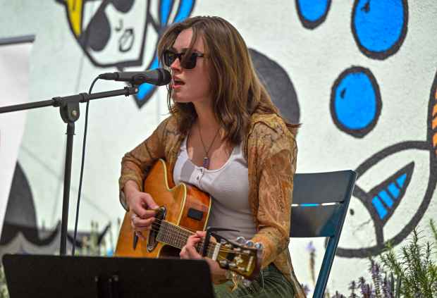 Ashton Livesay performs at Pour Co during Day of Music...