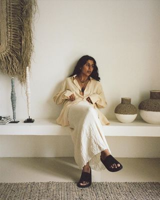 @monikh wearing St Agni slides with a skirt and shirt