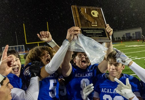 Acalanes’ Trevor Rogers (5) and Sully Bailey (9) raise the CIF NorCal 3-AA championship football trophy after the Dons defeated Escalon 49-14 on Dec. 1, 2023, in Lafayette. (Karl Mondon/Bay Area News Group)