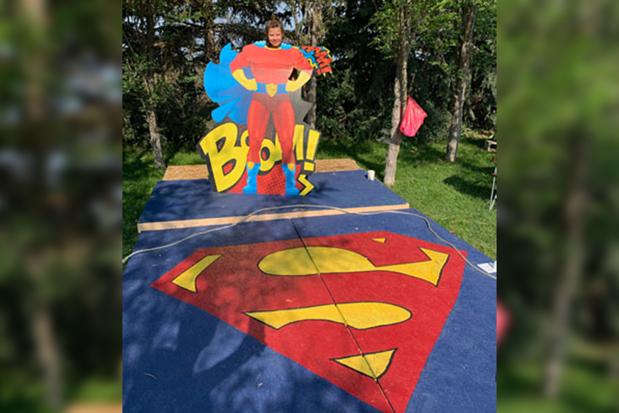 A young Superfan smiles on the stage before the show. | Courtesy Superfriends