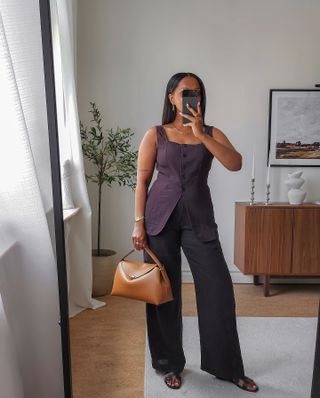 Influencer wears a plum outfit.