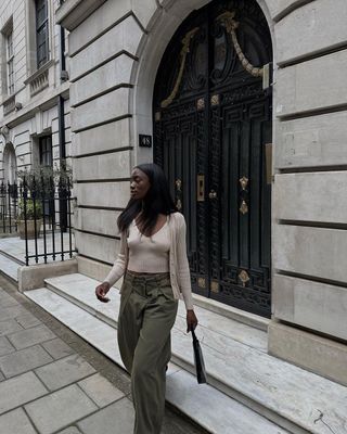 Beige cardigan and vest with green cargo trousers