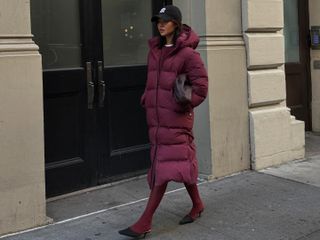 Fashion influencer @mimixn in New York City wearing a chic winter outfit styled with a puffer jacket.
