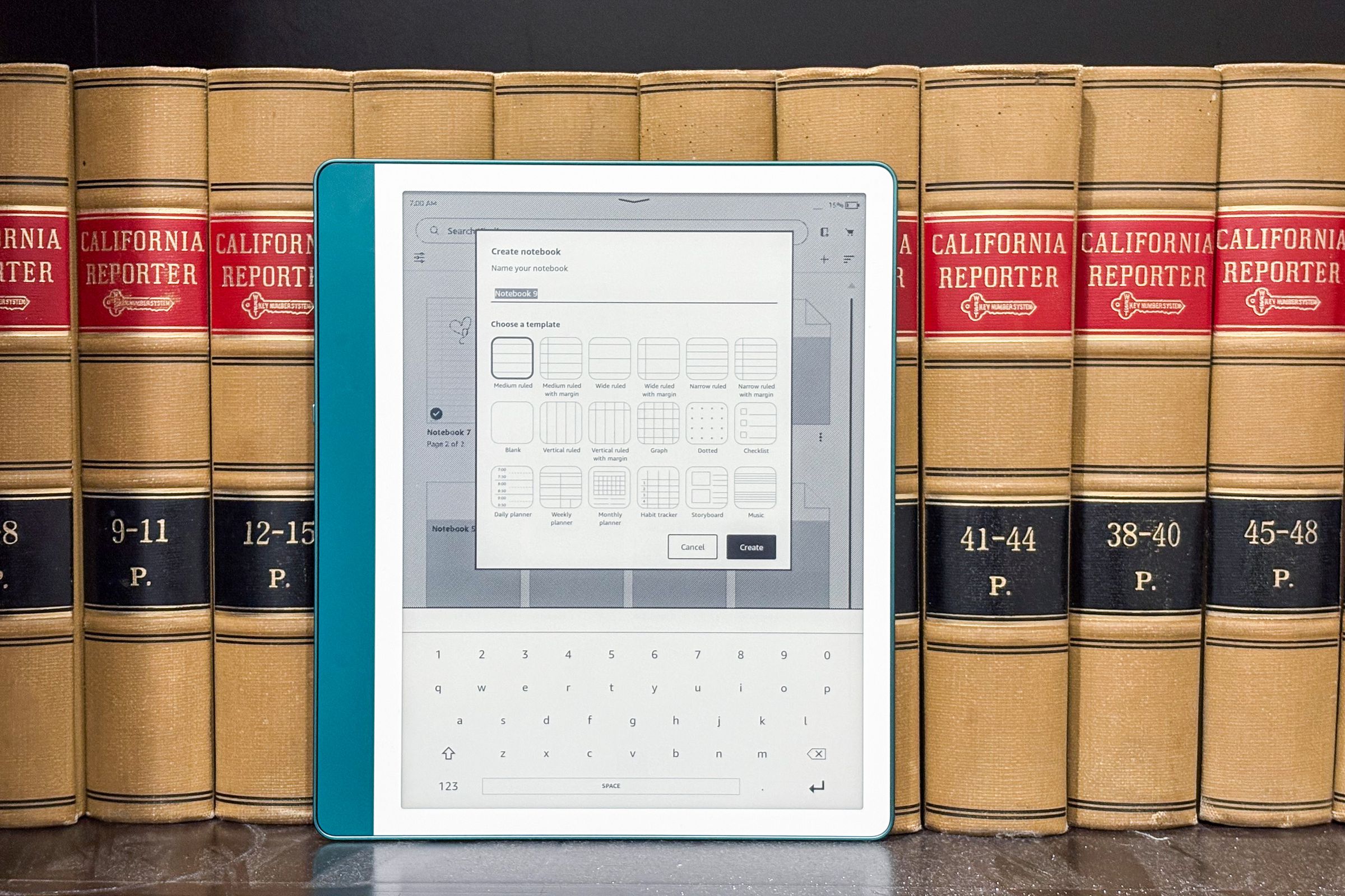 The Kindle Scribe sitting on a bookshelf, with its display featuring some of the other templates and pages Amazon provides.