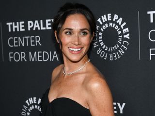 Meghan Markle wore a strapless black dress on the red carpet