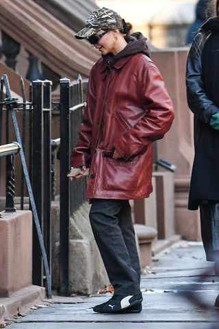 Emily Ratajkowski wearing a burgundy leather jacket