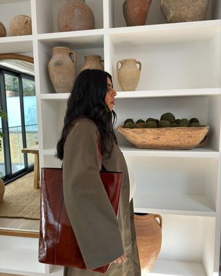 Monikh with Sezane patent shopper bag
