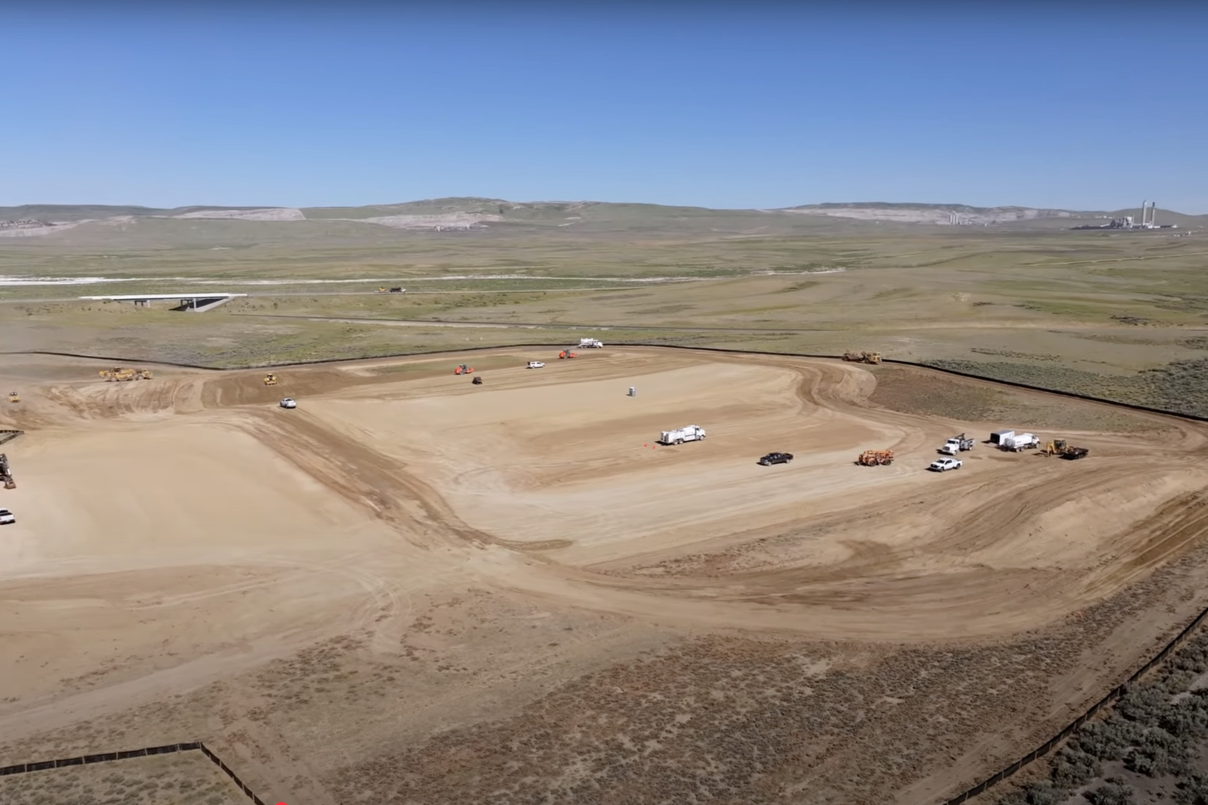 A view of vehicles driving across a construction site.