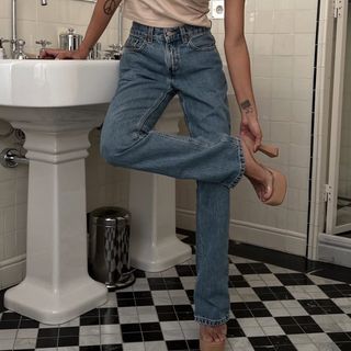 Jen Ceballos wearing vintage jeans and heels.