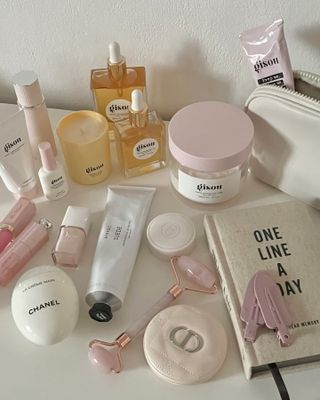 @pink_oblivion Gisou beauty products on a white table