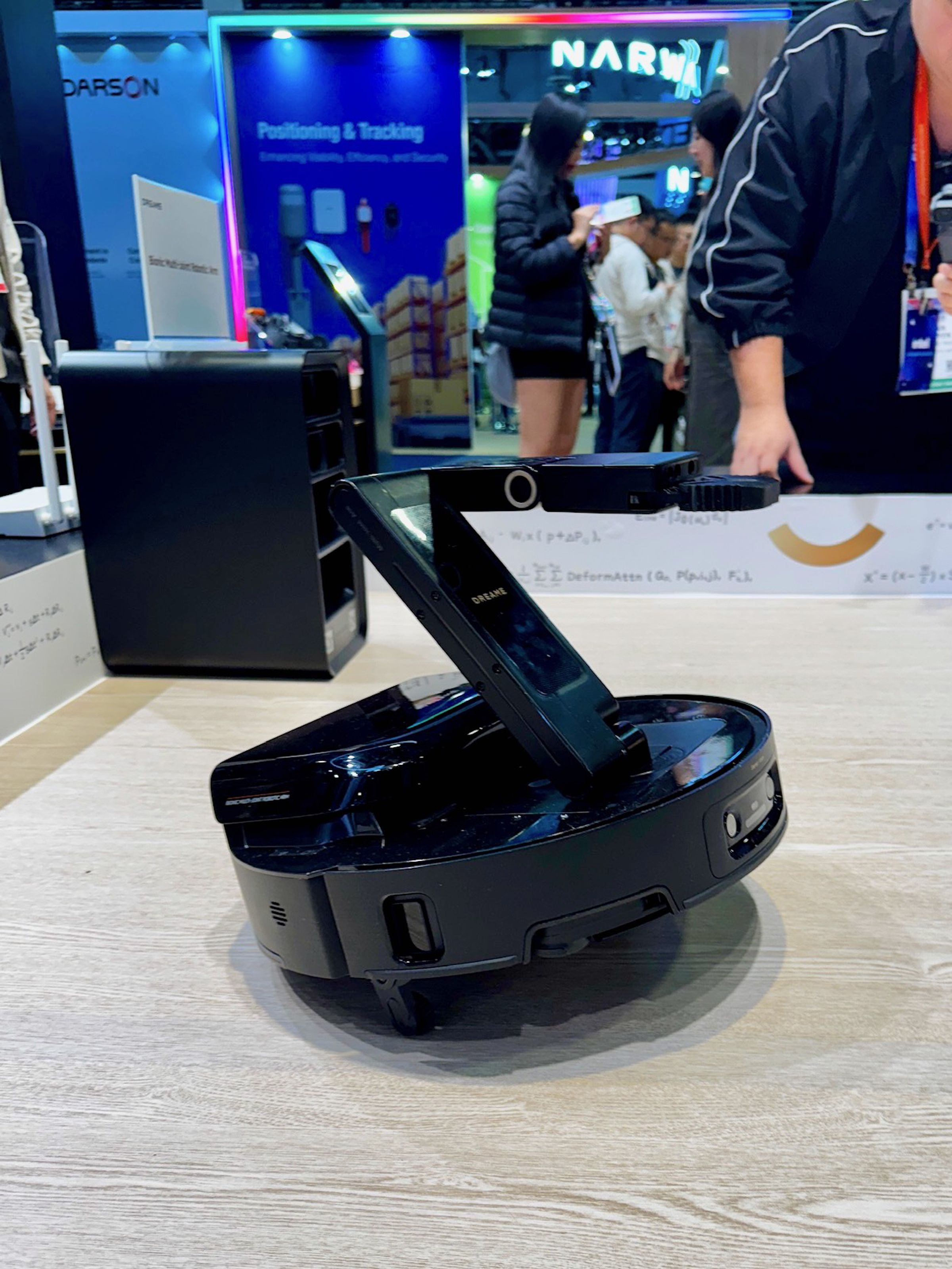 Dreame’s concept robot vacuum can lift itself up and has an arm for moving items out of its way.