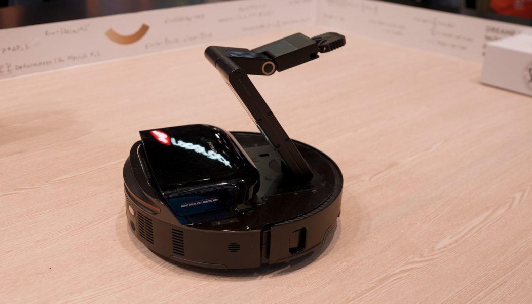 This robovac has an arm — and legs, too