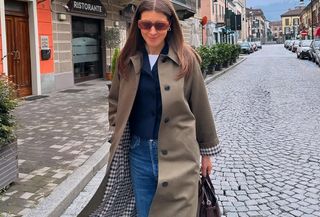 woman in trench coat and jeans
