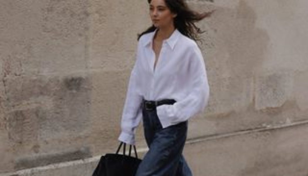 The Only Tops Stylish People Wear With This Viral Denim Trend