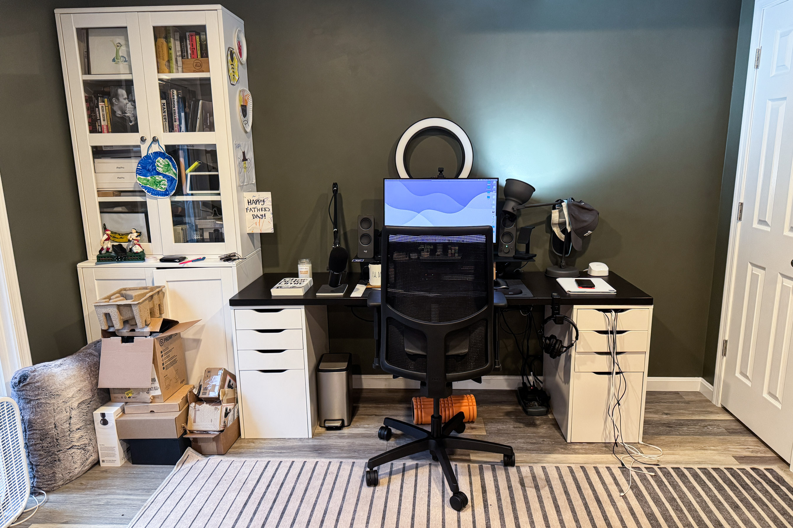 Basement workspace with desk, bookcase.