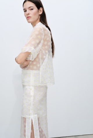 An image of a sheer embroidered floral set from Mango, which can be worn with alternatives to ballet flats.