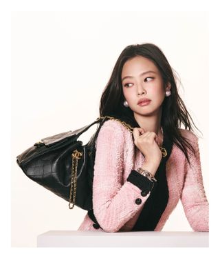 Jennie wears the Chanel 25 Handbag