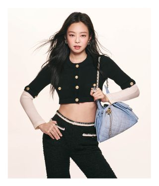 Jennie wears the Chanel 25 Handbag