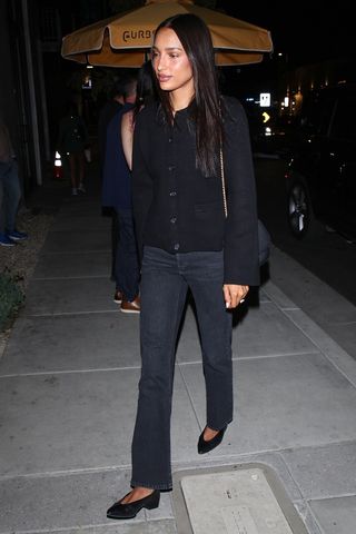 Jasmine Tookes wearing jeans and a cardigan out to dinner in L.A.