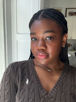 Who What Wear Associate Beauty Editor Maya Thomas wears the Armani Beauty Luminous Silk Cheek Tint Blush in Vivid Coral.