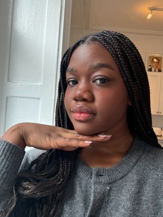 Associate Beauty Editor Maya Thomas wearing the Hourglass Unreal Liquid Blush in Imagine