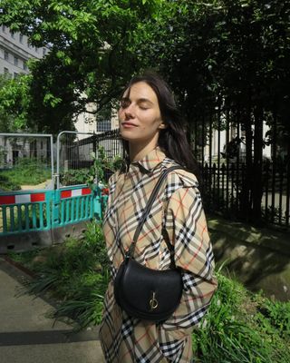 Devon Lee Carlson wearing a plaid Burberry outfit.