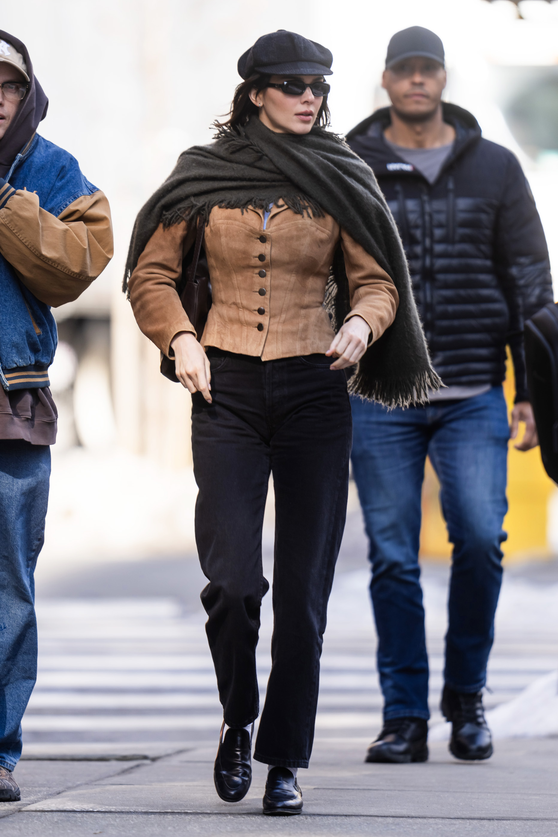 Kendall Jenner wearing a suede jacket and black pants