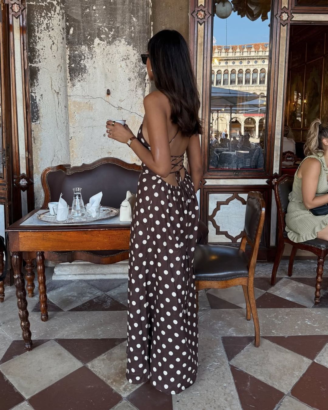 @cocobeautea wears a polka dot dress