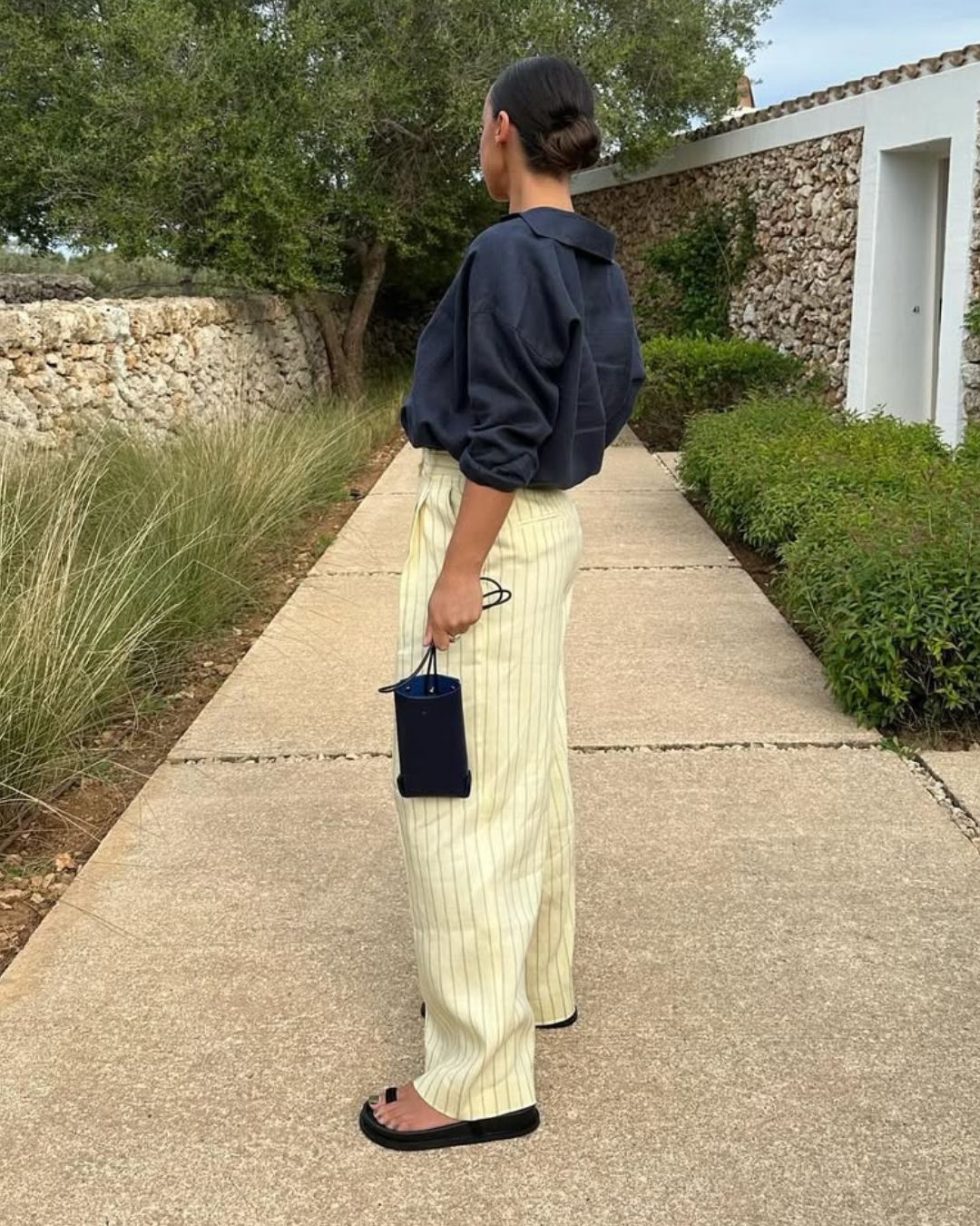 @emswells wears striped linen trousers