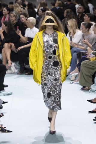 a runway model wears yellow