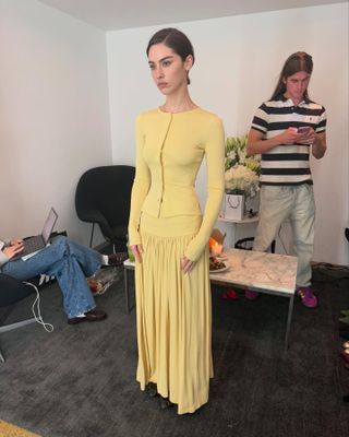 Gracie Abrams wears a butter yellow two-piece.