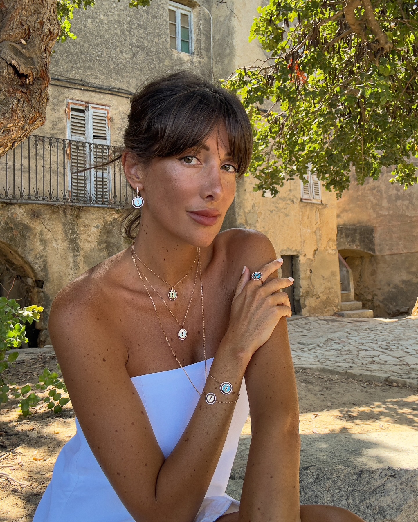 @juliesfi wearing a white dress on holiday