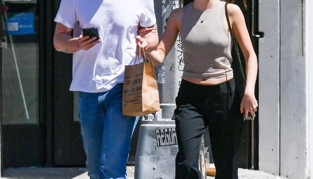 Daisy Edgar-Jones wears black trousers and mary janes.