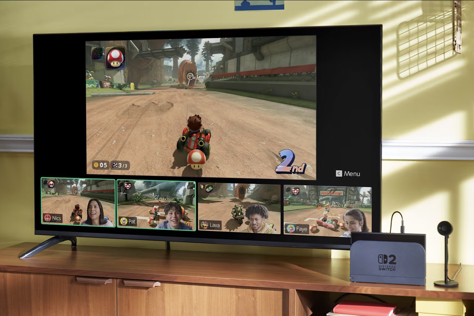 A close-up image of a Nintendo Switch 2 and a TV with Mario Kart World on the screen.