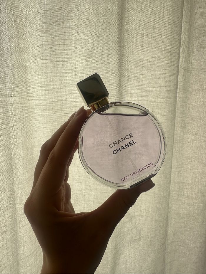 Shannon Lawlor holding a bottle of Chanel Chance Eau Splendide