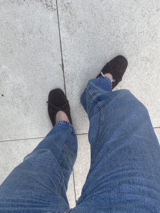 Natalie wearing the Arket suede ballet flats.