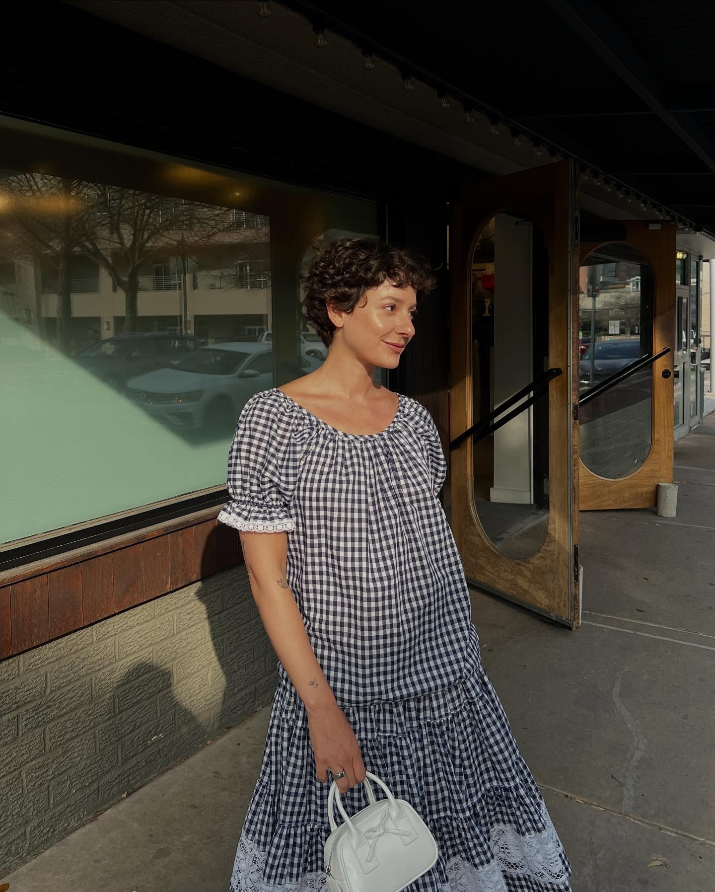 @alyssainthecity with a curly pixie haircut