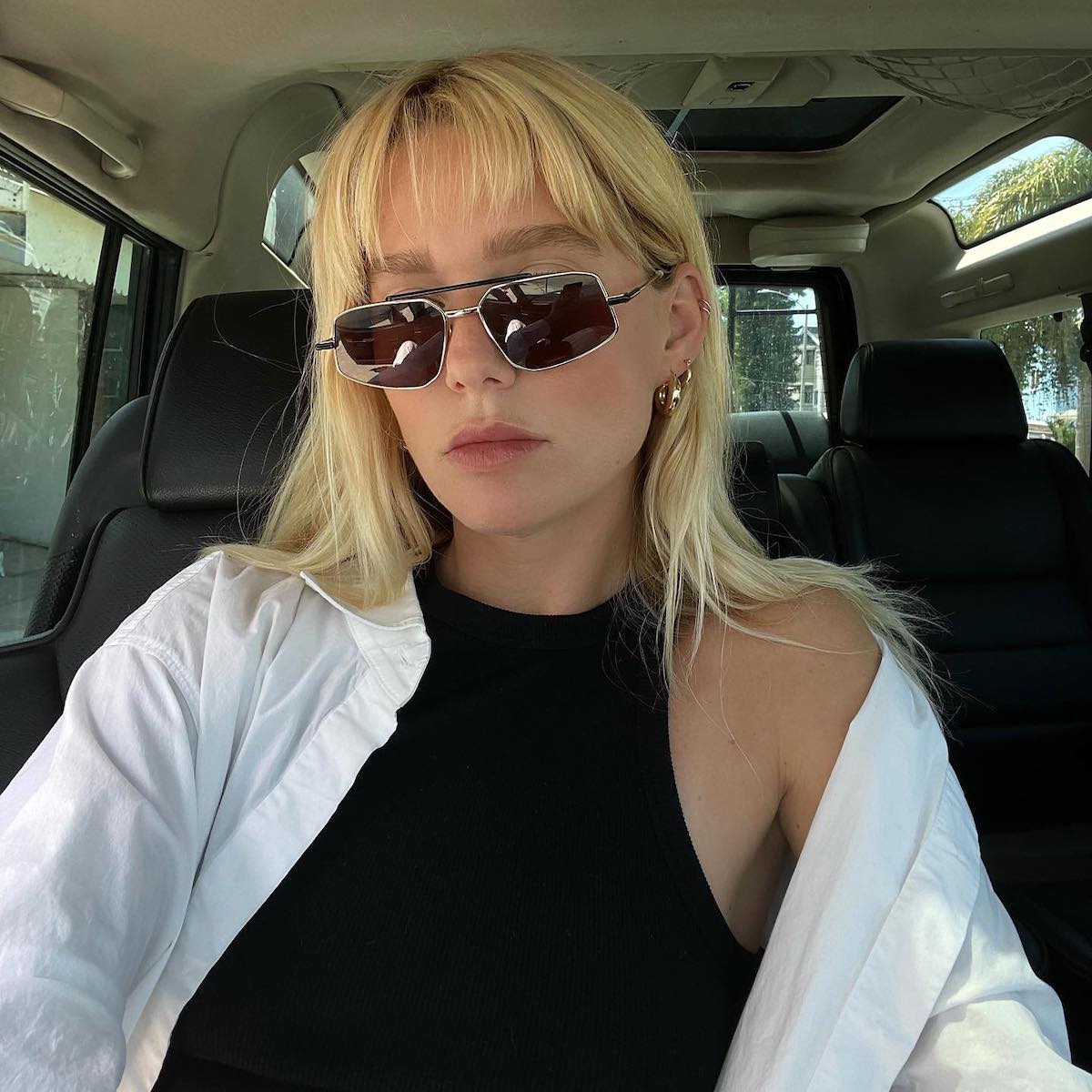 Woman with blonde hair and sunglasses