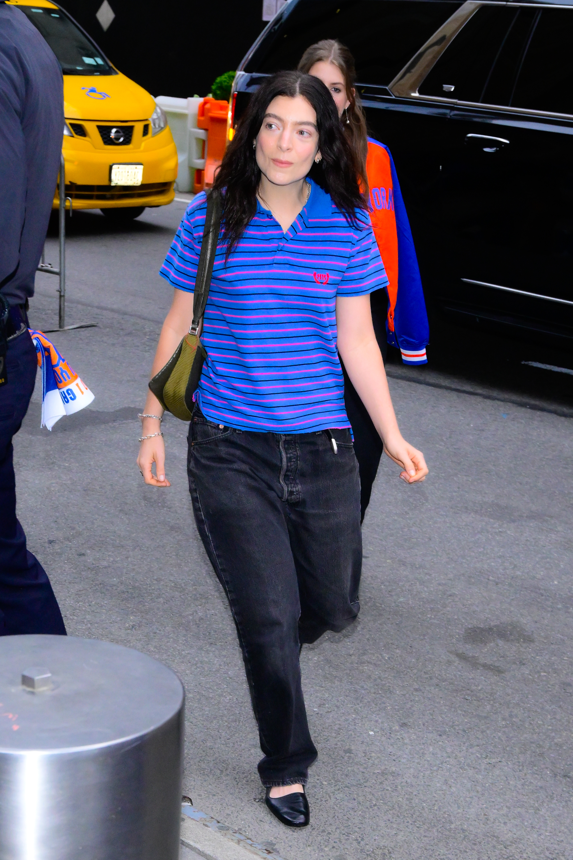 Lorde wears baggy jeans and ballet flats