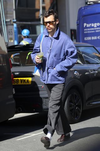 Harry Styles wears a chore jacket