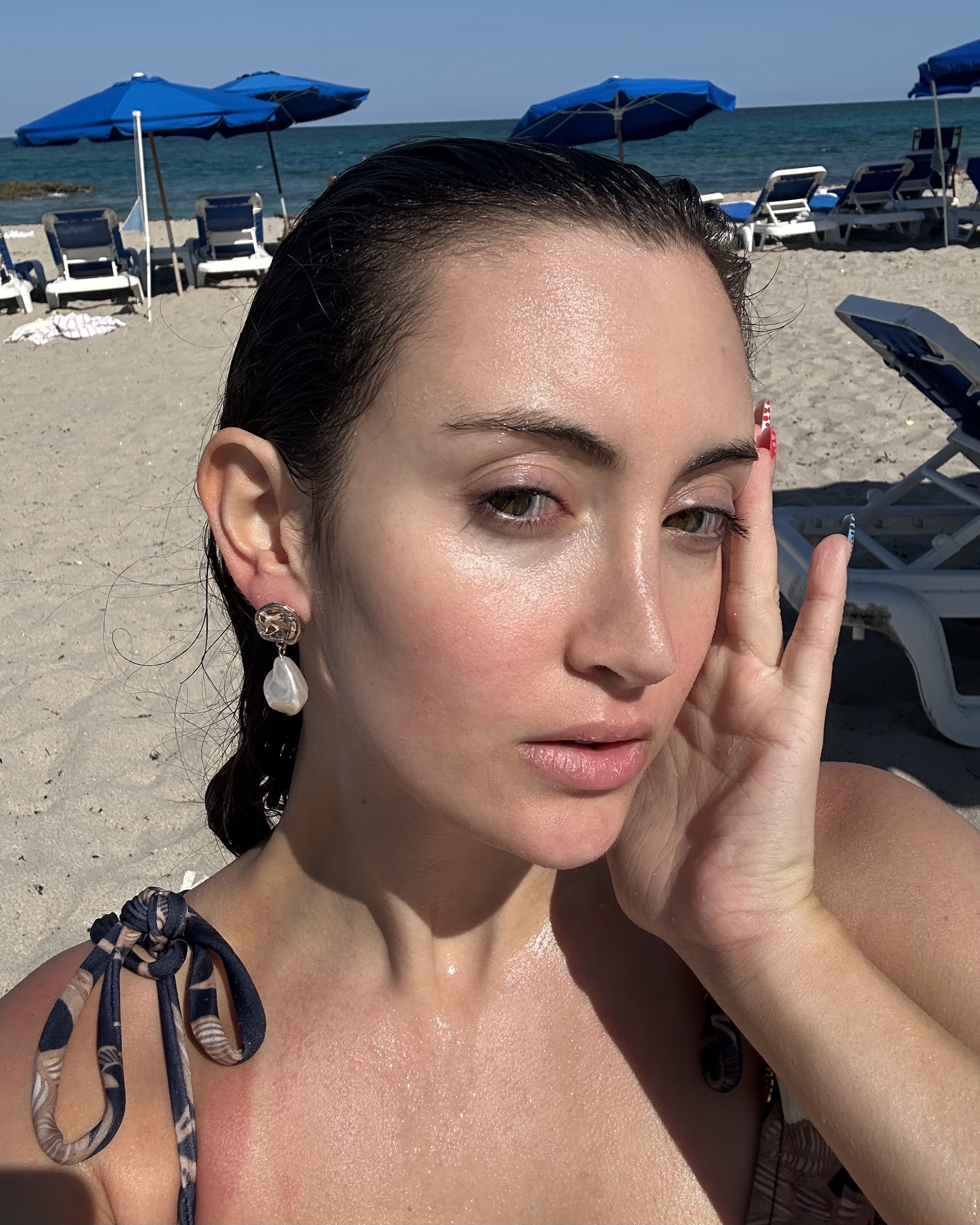 Alyssa Brascia after testing the Too Faced Better Than Sex Waterproof Mascara in the ocean.