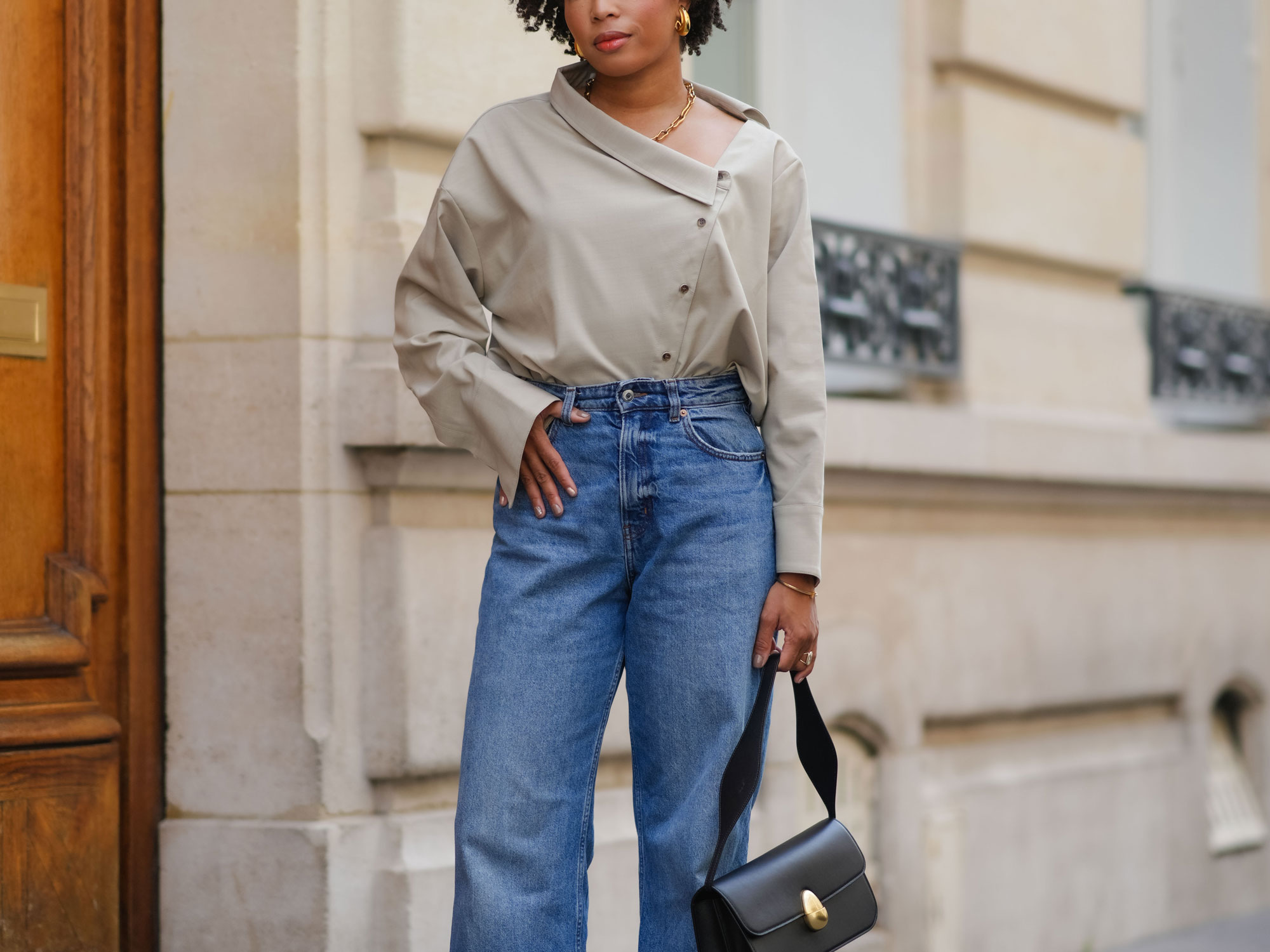 a woman wears wide-leg jeans