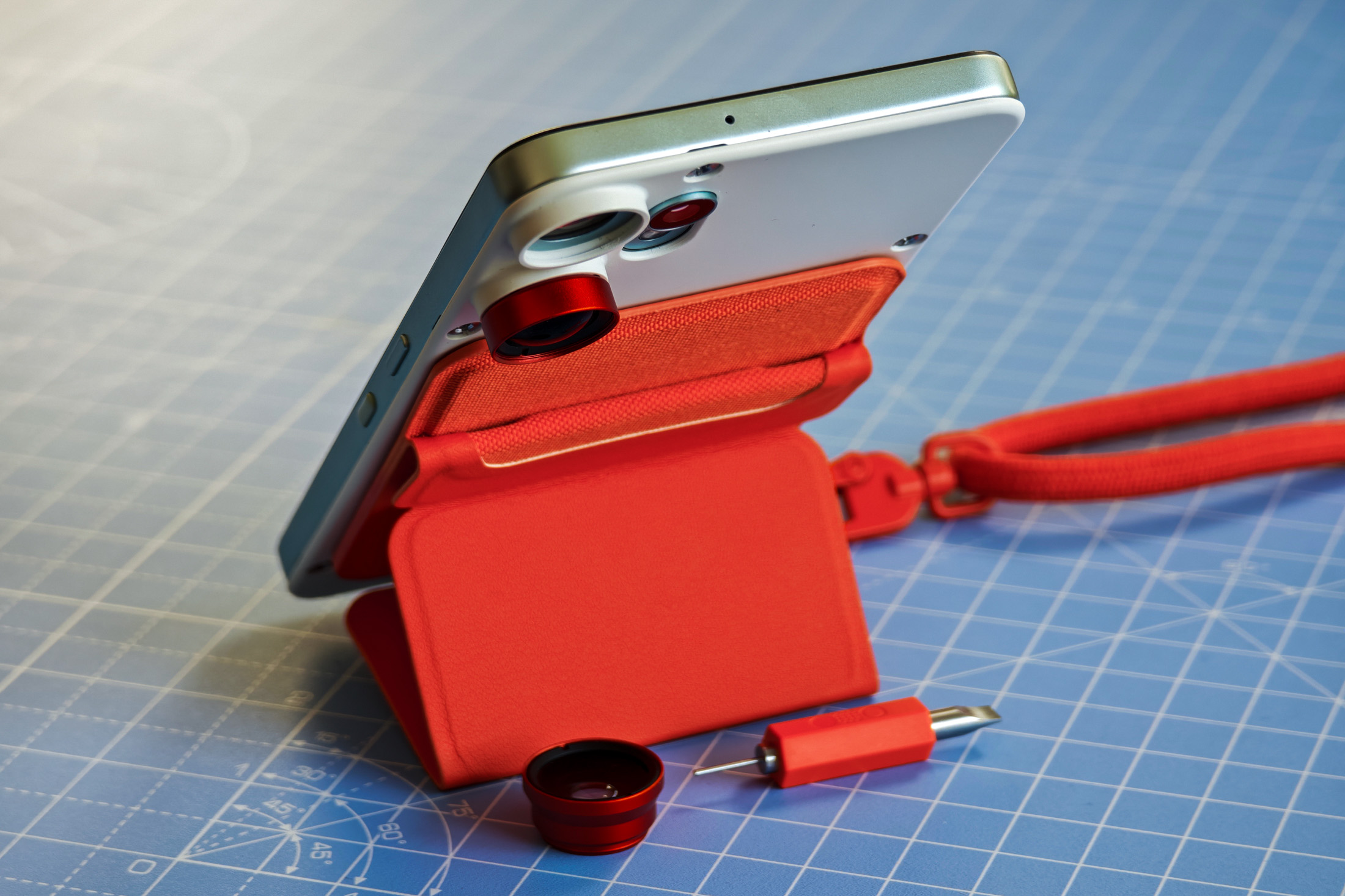 The CMF Phone 2 Pro with the lanyard and kickstand both attached, with one corner raised